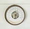 Ancient barometer on white wooden wall for weather measurement interior home and living decoration collection retro style