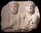 Ancient bas relief of Roman Grave Stele with family portrait depicting two men from Palmyra, Syria