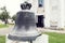 Ancient bell put on pedestal in front of the church of Cuza cast