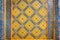 Ancient Benjarong ceramic texture paint tiles patterns Thai style on the wall decorate of Wat Ratchabophit temple on panel