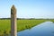 Ancient border pole in countryside between villages