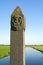 Ancient border pole in countryside between villages