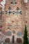 Ancient brick wall of The Kalozha church in Grodno, Belarus. Facade is decorated with majolica tiles and stones