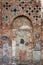 Ancient brick wall of The Kalozha church in Grodno, Belarus. Facade is decorated with majolica tiles and stones