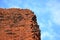 Ancient bricks from a part of a wall standing out in a bright blue cloudy sky