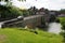 Ancient bridge over the river Gave d`Oloron at the town of Navarrenx, France