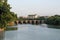 Ancient bridges and forests on the river at dusk