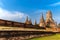 Ancient buddha sandstone statue front ruins pagoda