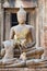 Ancient Buddha statue at the ruins of Prang Sam Yot, originally a Hindu shrine, converted to a Buddhist one in Lopburi, Thailand.