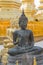 Ancient Buddhas with pagada background.