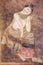 Ancient Buddhist temple mural depicting a Thai daily life scene