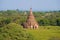 Ancient Buddhist temple in a sunny landscape. Bagan, Myanmar