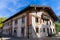 Ancient building with a balcony and wall decoration in afternoon under the sun