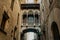 Ancient building - Pont del Bisbe Bishop Bridge alley in old part of Barcelona - Gothic Quarter. Popular travel