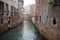 Ancient building surround with water in Venice on the canal, lifestyle in Italy, boat trip in Venezia