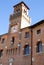 Ancient building with a tower and clock in Oderzo in the province of Treviso in the Veneto (Italy)