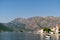 Ancient buildings on the coast of Perast against the backdrop of mountains. Montenegro