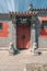 Ancient buildings with gray brick wall and Chinese lion stone in the Beijing Ancient Architecture Museum