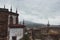 Ancient buildings with steeples on river Minho bank. Top provence view in Tui, Spain. Medieval architecture concept.