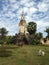 Ancient cambodian temple. Cow next to the building, lonely motorbike, no people. Abandoned place, rural area.