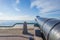 Ancient cannon protecting the coast of the dutch city of Vlissingen below a blue sky