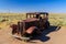 Ancient car alone in the Desert.