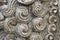 Ancient carved stone curls closeup abstract horizontal background