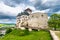 Ancient castle Trencin, Slovakia. Old fort on the hill, big walls and towers. Summer day, dramatic clouds before storm