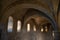 Ancient cathedral of Brescia. Inner passage with stone arches