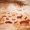 Ancient cave paintings decorate the walls