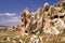 Ancient cavetown near Goreme, Cappadocia, Turkey. View to cliff dwellings