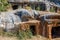 Ancient cemetery in the city of Limyra, Turkey. The entrance to the old concrete tomb in the rock. Excursion to the