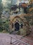 Ancient chapel carved in sandstone rock Modlivy Dul dedicated to the Virgin Mary of Lourdes in beautiful autumn forest near