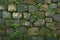 Ancient charm moss covered stone wall, a timeless and rustic texture