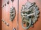 Ancient Chinese architecture door and copper dragon head door knockers on it.