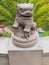 Ancient Chinese Emperor lion statue on a stone pedestal