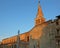 Ancient church and bell tower of Santa Eufemia in the city calle