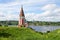 Ancient church of the Icon of the Mother of God Kazan against the background of summer Volga in the July afternoon. Tutaev, Russia