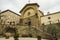 The ancient church Propositura di San Niccolo and the old fountain in the Tuscan medieval town