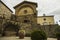 The ancient church Propositura di San Niccolo and the old fountain in the Tuscan medieval town