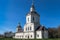 Ancient church with white walls against the blue clear sky