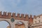Ancient city gate with clock of Verona, Italy