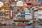 Ancient city of Porto with old multi-colored houses with red roof tiles. Portugal, Porto