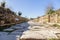 Ancient city Side, Turkey. Old paving stone road, antique ruins. Shadow of the wall on sunny day. Selective focus