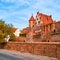 Ancient city wall and medieval brick buildings of Torun old town, UNESCO world heritage site, in Autumn