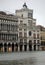 ancient Clock in Venice with high tide