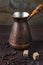 Ancient coffee maker on a dark wooden background
