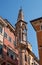 An ancient column on the street in Verona. A small Gothic column with sculptures of Our Lady and Saints Christopher and