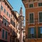 An ancient column on the street in Verona. A small Gothic column with sculptures of Our Lady and Saints Christopher and