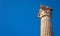 Ancient Corinthian column on blue sky background, Athens, Greece